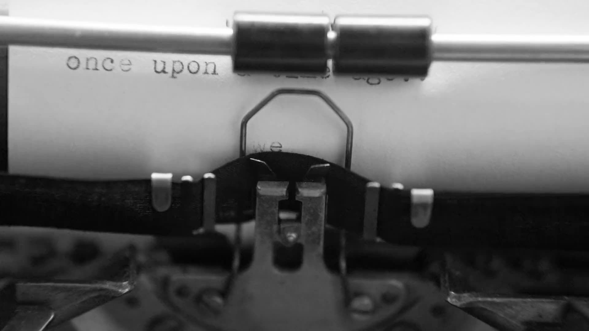 Hands at a typewriter, black and white